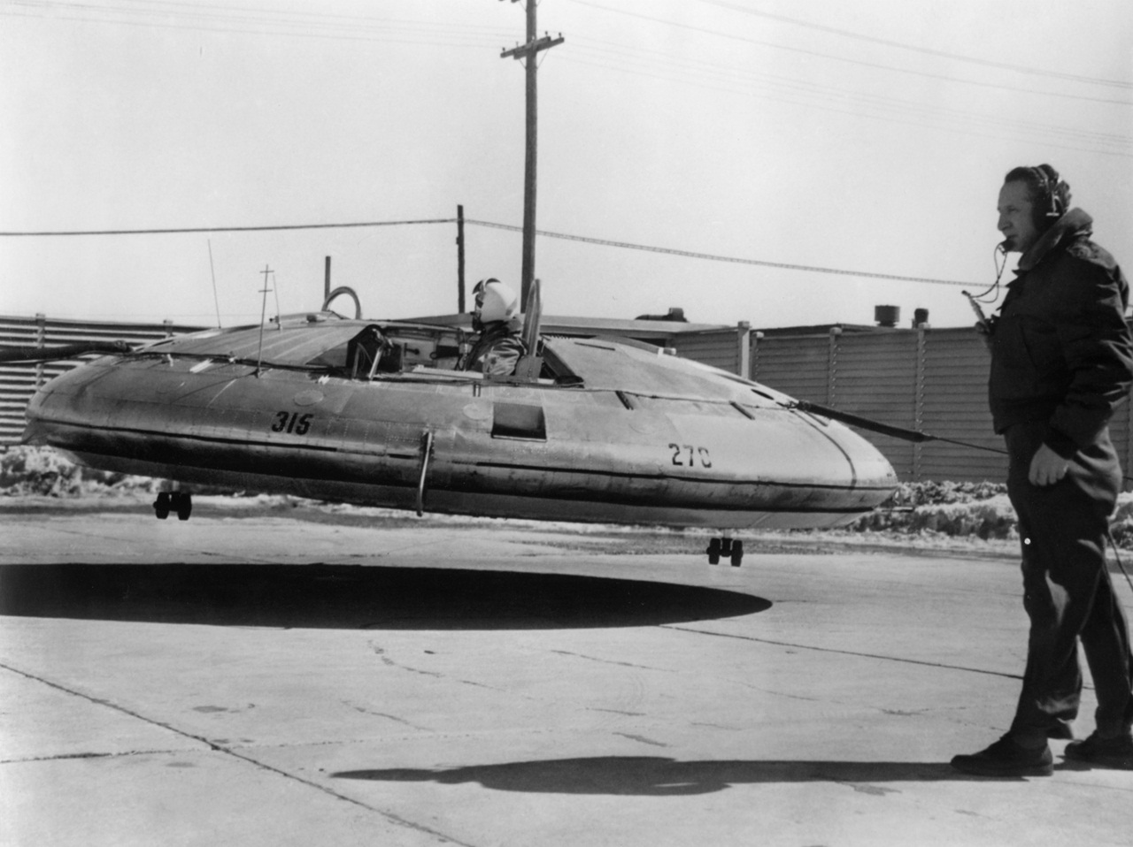 Before free-flight tests, the Avrocar was flown with tethers, seen here in front and behind the aircraft, for safety reasons. (U.S. Air Force photo)